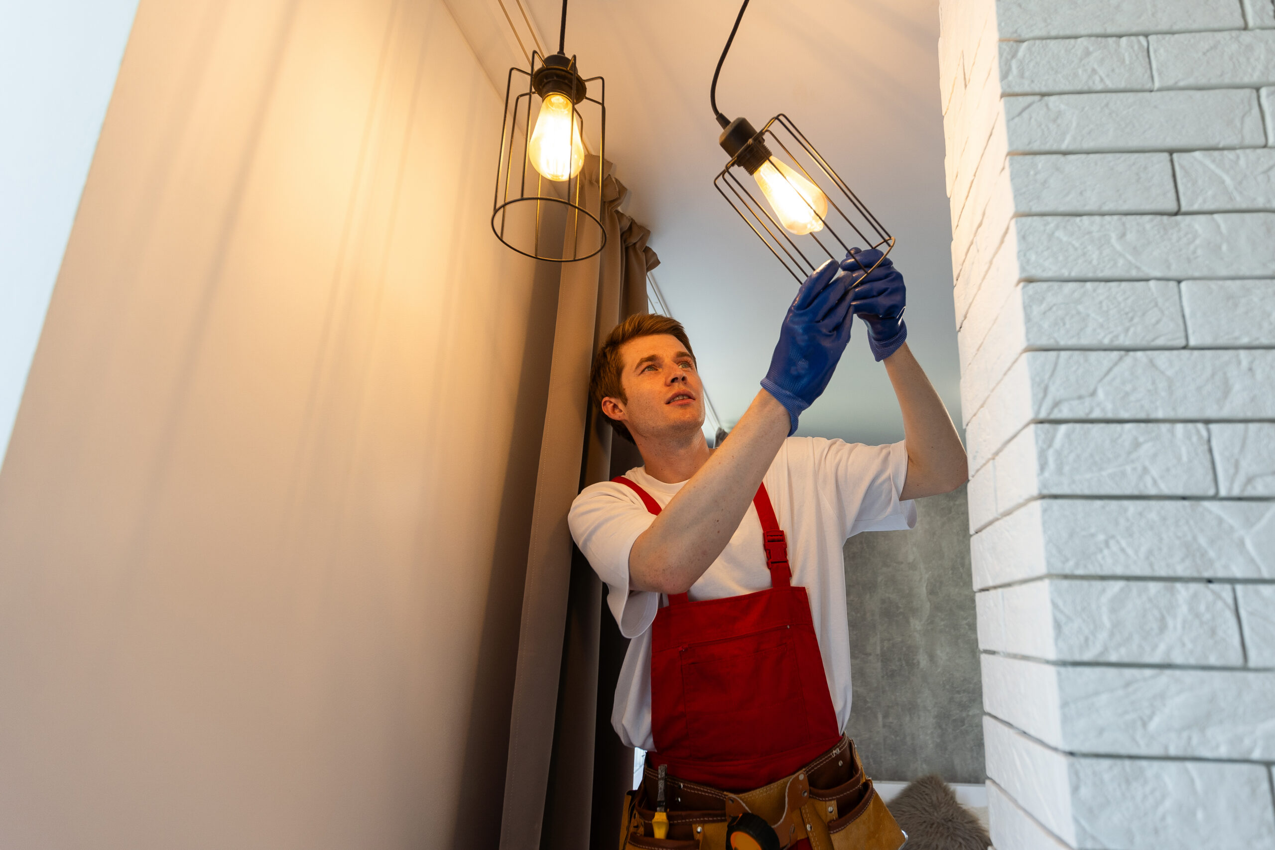 maintenance man repairing light fixtures in home 2026 03 17 20 16 58 utc